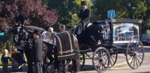 image of horse and carriage hearse for rowland brothers funeral directors