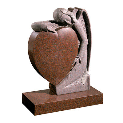 image of an imperial red granite headstone with a hand carved angel holding a heart for a product listing for a headstone