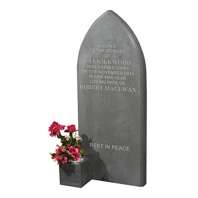 image of a green slate memorial in a gothic style with a vase and non reflective finish for a product listing for a monolith or boulder memorial