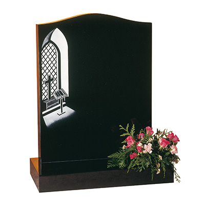 image of a black granite headstone with the design of a church window for a product listing for a headstone