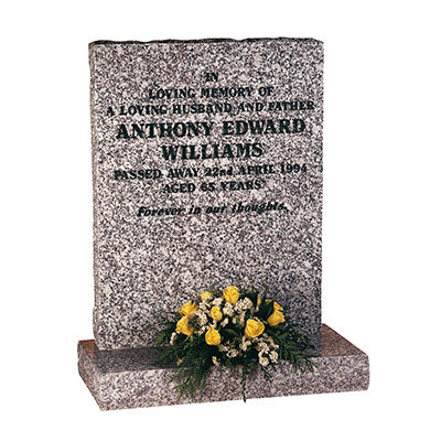 image of a mervyn grey granite rustic hand carved memorial with natural rock pitched edges for a product listing for a rustic and hand carved memorial