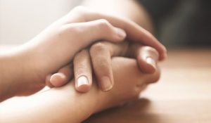 Funeral Directors Croydon Funeral Directors Croydon - Image of holding hands for rowland brothers bereavement support services in croydon