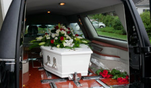 white casket, undertakers croydon